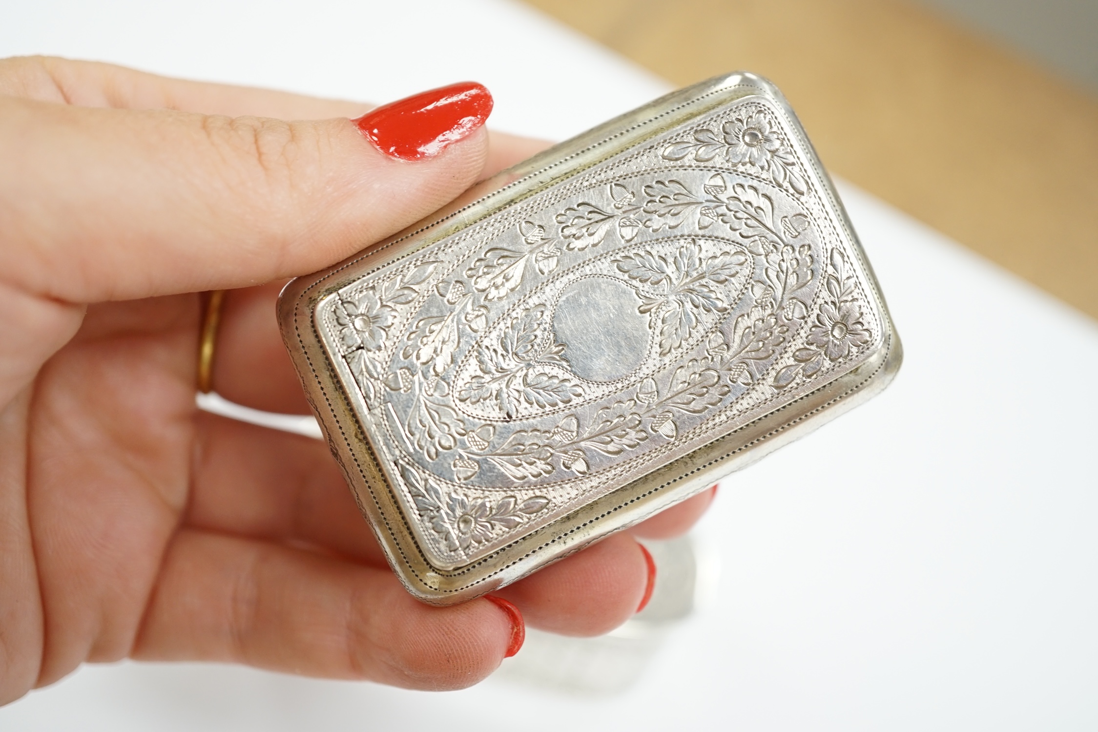 A George III engraved silver oval snuff box, by Phipps & Robinson, London, 1793, 70mm and one other Georgian silver snuff box.